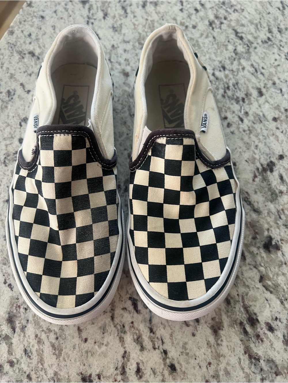 Vans Slip-On Checkerboard Sneakers in Black and Cream